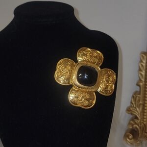 Elegant Gold and Black Brooch